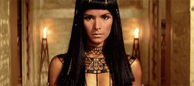 Woman In Choker And Necklace With Long Black Hair GIF