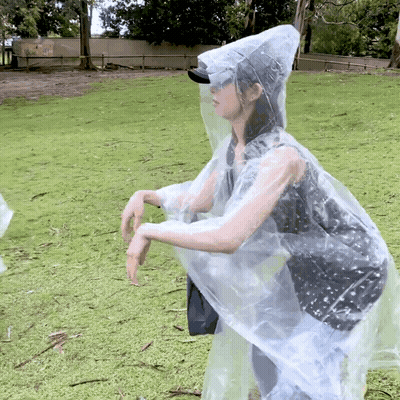 Woman In Clear Plastic Raincoat GIF