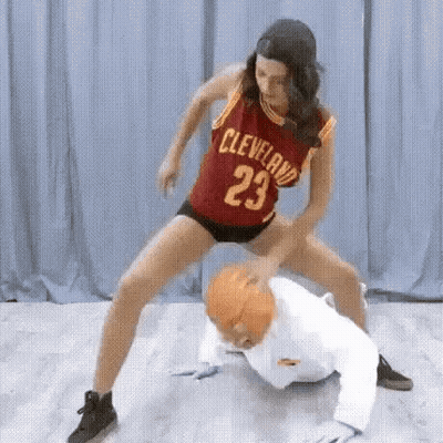 Woman In Cleveland Jersey Playing Basketball With Man In White Suit GIF