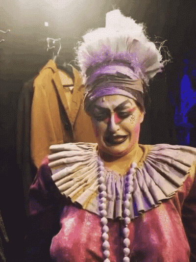 Woman in Clown Costume with Large Collar and Pearls