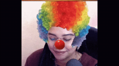 Woman In Clown Wig And Red Nose GIF