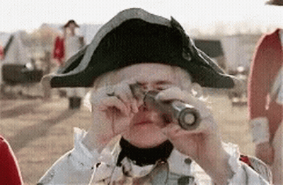 Woman In Colonial Uniform Looking Through Telescope GIF