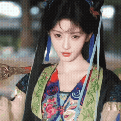 Woman In Colorful Costume Holding Sword GIF