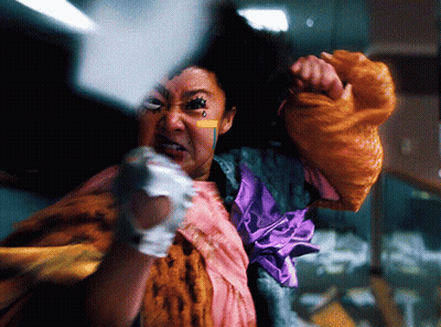Woman In Colorful Costume With Tear On Face GIF