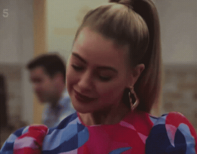 Woman In Colorful Dress And Earrings Number 5 GIF