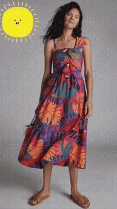 Woman In Colorful Dress In Front Of Yellow Sun GIF
