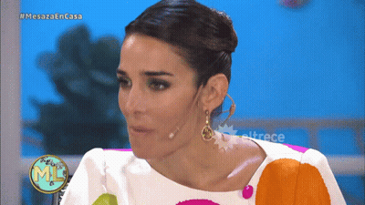 Woman In Colorful Dress On Mesaza Encasa GIF