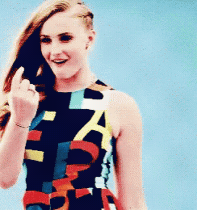 Woman In Colorful Dress With A Flipping Off GIF
