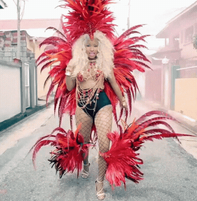 Woman In Colorful Feathered Costume Walking GIF