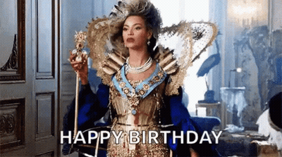 Woman In Colorful Outfit Holding Microphone On Stage GIF