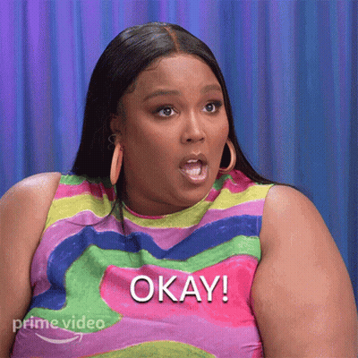 Woman In Colorful Shirt Saying Okay GIF