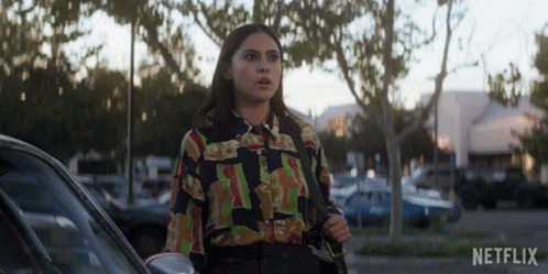 Woman In Colorful Shirt Standing Next To Car With Netflix GIF