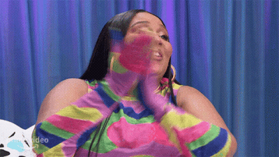 Woman In Colorful Striped Shirt And Gloves GIF
