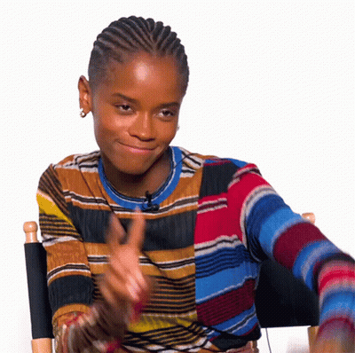 Woman In Colorful Striped Sweater Clapping GIF
