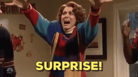 Woman In Colorful Sweater Screaming Surprise GIF