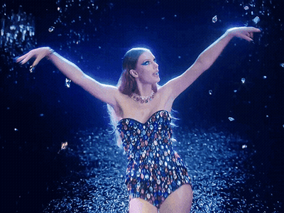 Woman In Colorful Swimsuit Dancing In Rain GIF