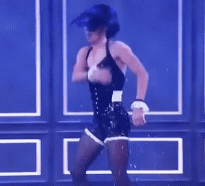 Woman In Corset And Shorts Dancing On Stage GIF