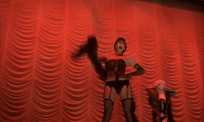 Woman In Corset Dancing On Stage GIF