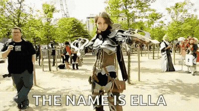Woman In Cosplay With Man Taking Photo In Park GIF
