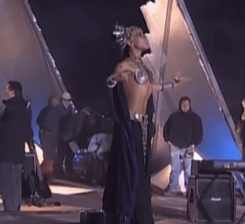 Woman In Costume Dancing In Front Of Crowd GIF