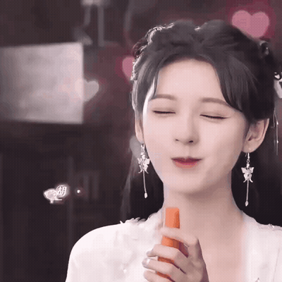 Woman In Costume Holding Carrot GIF