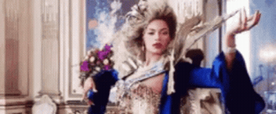 Woman In Costume Holding Sword GIF