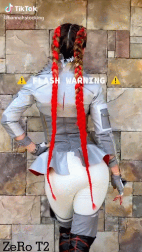 Woman In Costume With Red Braids GIF