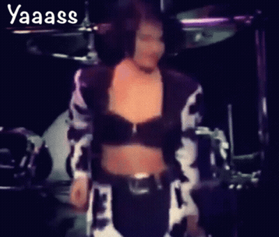 Woman In Cow Print Crop Top Dancing In Front Of Drum Set GIF