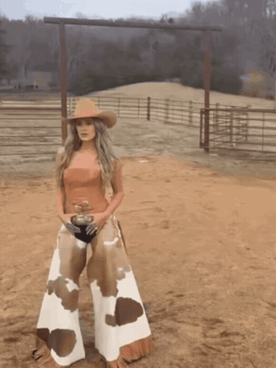 Woman In Cowboy Hat And Chaps GIF
