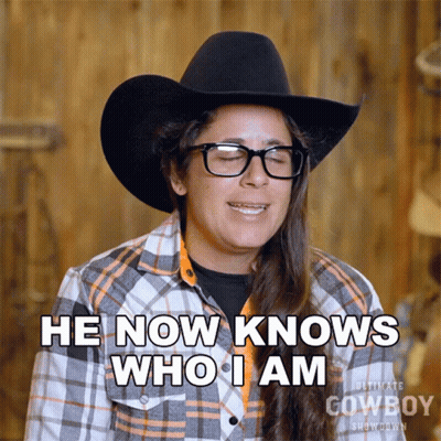 Woman In Cowboy Hat And Plaid Shirt Says I Know Who I Am GIF