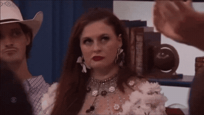 Woman In Cowboy Hat Beside Man In Blue Shirt GIF