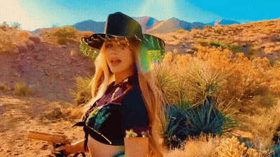 Woman In Cowboy Hat Holding Gun GIF