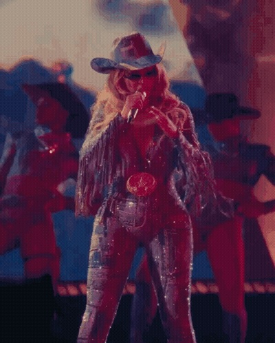 Woman In Cowboy Hat Singing On Stage GIF