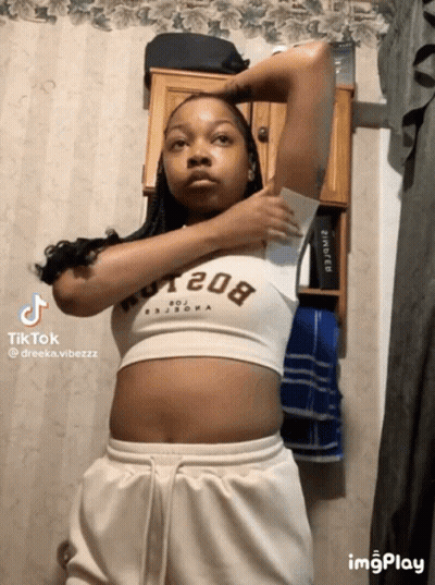 Woman In Crop Top 208 Holding Paper GIF