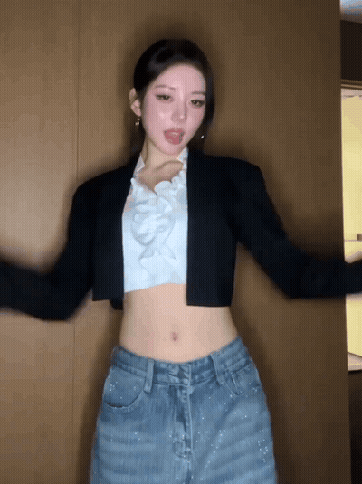 Woman In Crop Top And Jeans Dancing GIF