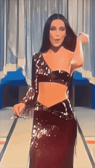 Woman In Crop Top And Long Skirt Dancing On Stage GIF