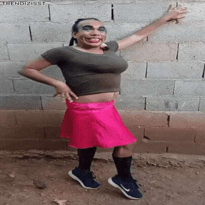 Woman In Crop Top And Pink Skirt Arms Out GIF