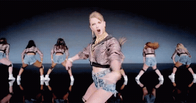 Woman In Crop Top And Shorts Dancing With Dancers GIF
