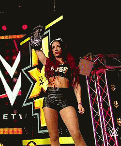 Woman In Crop Top And Shorts Holding Wrestling Glove GIF