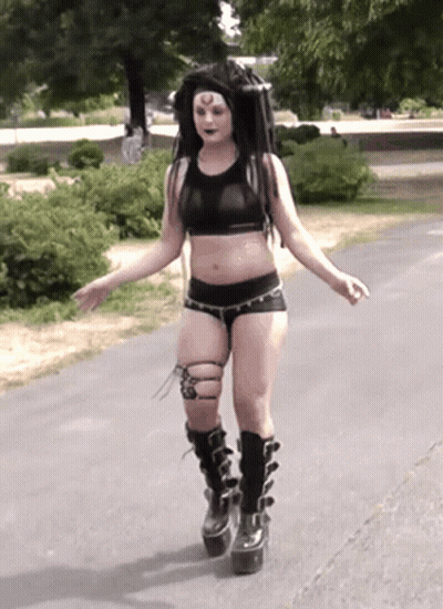 Woman In Crop Top And Shorts Walking GIF