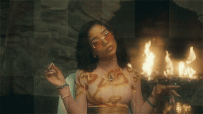 Woman In Crop Top And Sunglasses At Fireplace GIF