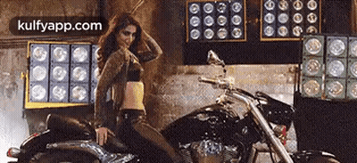 Woman In Crop Top Dancing On Motorcycle GIF