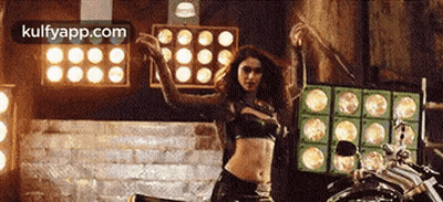 Woman In Crop Top Dancing On Motorcycle GIF