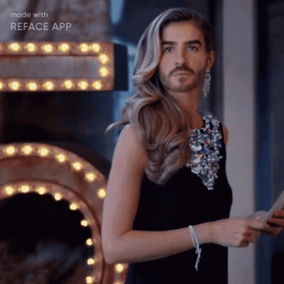 Woman In Crop Top Dancing On Stage With Hands On Head GIF