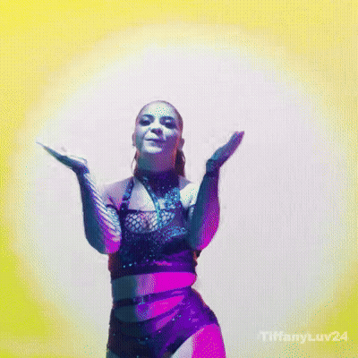 Woman In Crop Top Dancing With Man Wearing NC Shirt GIF
