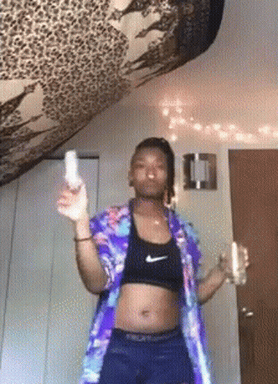Woman In Crop Top Nike Shorts Holding Wii Remote GIF