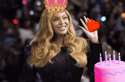 Woman In Crown Holding Heart Next To Birthday Cake GIF