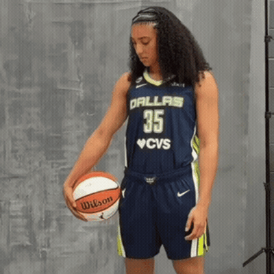 Woman In Dallas 35 Jersey Holding Wilson Basketball GIF
