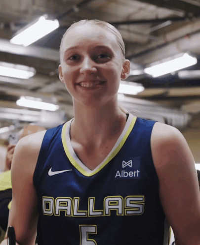 Woman In Dallas Basketball Jersey Smiling GIF