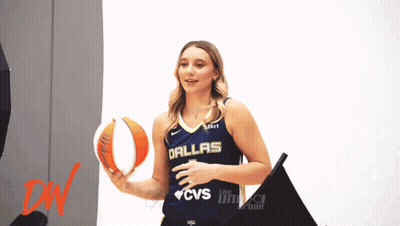 Woman In Dallas Jersey Holding Basketball GIF